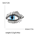 Vintage silver evil eye brooch with realistic blue pupil and textured metal eyelashes - Black