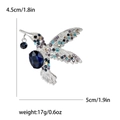 Élégante broche colibri avec strass colorés et pierre centrale bleu foncé sur base argentée - Style Argenté (4206)