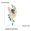 Elegante broche de fénix dorado con cristales verdes y pedrería con sus medidas - Verde