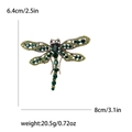 Elegant vintage gold dragonfly brooch with green rhinestones and crystal wing details - Green