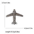 Zilveren vliegtuigbroche met champagne strass, 4,3 cm breed en 3,7 cm hoog sieraad - Zwart