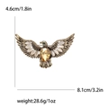 Vintage golden eagle brooch with amber gemstone and cat eye stones in 8.1cm width - Brown