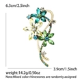 Elegante broche de flor dorada con pedrería de colores de 6,3 cm por 3,9 cm - Verde