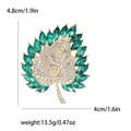 Vintage gold maple leaf brooch with green marquise gems and white rhinestones - Green