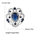 Vintage Barockbrosche mit dunkelblauem Tropfenedelstein und weißen Zirkon-Akzenten - Blau