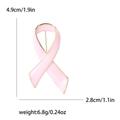 Elegant pink enamel ribbon brooch with gold trim, size 4.9cm by 2.8cm, lightweight design - Pink