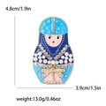 Detalle de broche de muñeca rusa con esmalte azul y pedrería en estilo vintage - Azul