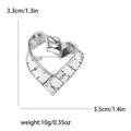 Vista macro detallada del broche de cinta métrica con forma de corazón en plata vintage - Estilo Cinta Métrica Plata Vintage (4224-SL) / Plateado