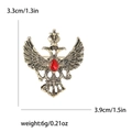 Vintage double-headed eagle brooch with red gemstone and rhinestone alloy finish - Gold