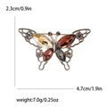 Broche de mariposa dorado vintage con cristales multicolor y detalles calados - Morado