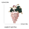 Pink rhinestone grape brooch in gold alloy with green leaf accents and size markers - Pink