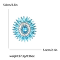Sonnenblumen-Brosche mit blauen Strasssteinen in Silberoptik inklusive Maßangaben - See Blau