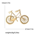 Spilla a forma di bicicletta dorata con piccoli strass bianchi per completi - Oro