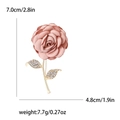 Detail view of pink fabric rose brooch with golden rhinestone leaves and dimensions - Pink