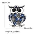 Elegant vintage owl brooch in silver alloy with blue rhinestones and dimensions - Blue