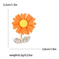 Detail view of daisy brooch with orange enamel petals and measurement dimensions in inches - Red