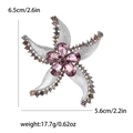 Elegant starfish brooch with purple crystals and colorful rhinestones on silver metal base - Starfish Shape / Purple