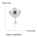 Elegant vintage gold alloy brooch with emerald gemstone and pearl drop pendant - Green