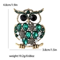 Vintage gold-tone owl brooch with green crystals and black rhinestone eyes - Green