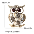 Antique gold owl brooch with amber rhinestones and red crystal eyes, 4.8cm height - Brown