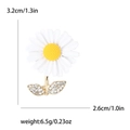 Daisy enamel brooch with white petals and gold leaf detailing, size 3.2cm by 2.6cm - White