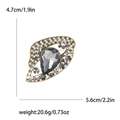 Vintage alloy flying saucer brooch with grey pear-shaped crystal and rhinestone inlay - Black