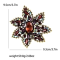 Detailed view of bohemian star floral brooch with brown crystals and vintage gold finish - Purple