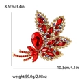 Elegant red maple leaf brooch featuring vibrant crystals and golden alloy metal base - Red