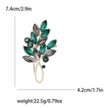 Broche élégante en forme de feuille dorée avec strass émeraude et gris, dimensions - Vert