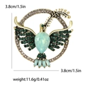 Broche artístico de paloma dorada con cristales verdes y pedrería color champán - Verde