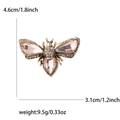 Detail view of a vintage bee brooch with pink crystals and clear rhinestones - Champagne