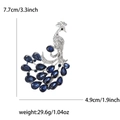 Detail view of rhinestone peacock brooch with size dimensions 7.7cm by 4.9cm and weight info - Blue