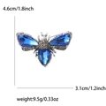 Elegant silver-toned insect brooch with blue faceted gems and sparkling crystals, 4.6cm height - Blue