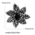 Grande spilla vintage a fiocco di neve con strass neri e cristalli scuri - Nero