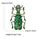 Green enamel beetle brooch with multi-color rhinestones and retro gold finish - Green