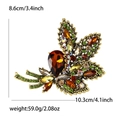 Vintage gold alloy brooch with colorful rhinestones and intricate maple leaf design - Brown