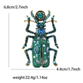 Deep green enamel beetle brooch with blue rhinestones and gold-tone finish - Lake Blue