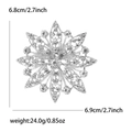 Detailed macro view of sparkling rhinestone flower brooch showing exact product dimensions - Silver