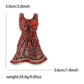 Detail shot of red dress brooch with rhinestones showing size 5.0cm by 3.6cm - Red