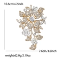 Detail showing dimensions of a large crystal flower brooch in gold with white rhinestones - Gold