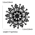 Detailansicht der Strass-Sonnenblumenbrosche mit Größe 5,2cm und Gewicht 17,5g - Schwarz