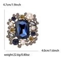 Broche vintage de luxe avec pierre bleue, perles et cristaux sur métal argenté antique - Bleu