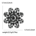 Detail view of flower brooch showing intricate hollow design and dark grey rhinestones - Black