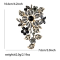 Vintage large gold-finish alloy floral brooch with black crystals measuring 10.6cm - Black