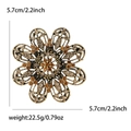 Exquisite hollow floral brooch with amber rhinestones and 5.7cm diameter measurement - Brown
