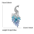 Elegante spilla a pavone in argento con cristalli blu e dimensioni dettagliate - Blu