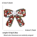 Vintage strikbroche van goudkleurige legering met gekleurde strass en witte parelaccenten - Rood