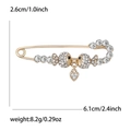 Spilla a forma di pesci dorati con strass e ciondolo a cuore, misura 6,1cm per 2,6cm - Oro