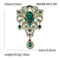 Spilla vintage di lusso con gemme verdi in finitura dorata e dettagli delle dimensioni - Verde