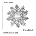 Elegant snowflake brooch with pearls and rhinestones measuring 5.4cm high and 5.1cm wide - Silver